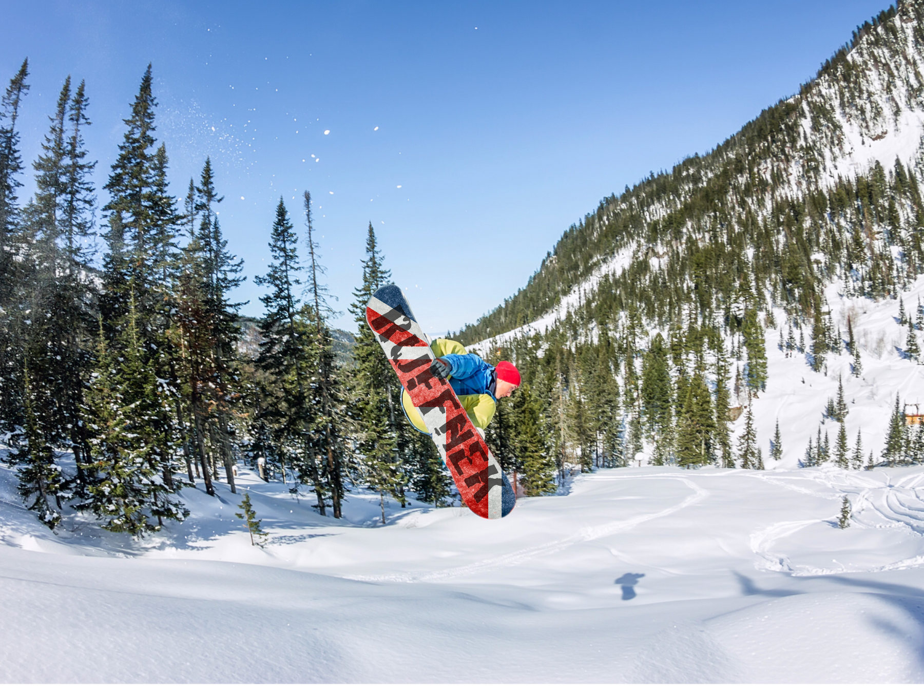 Man performing a snowboarding jump wearing a Ruffnek scarf