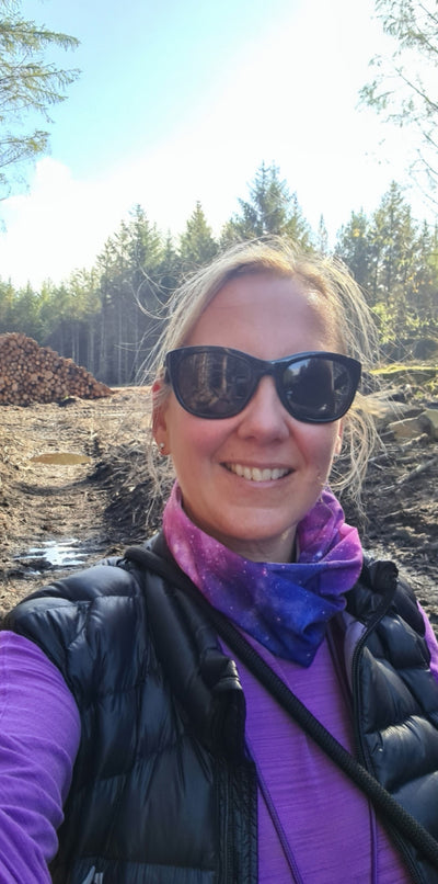Women wearing purple Milky Way Ruffnek snood on a hike in the forest.